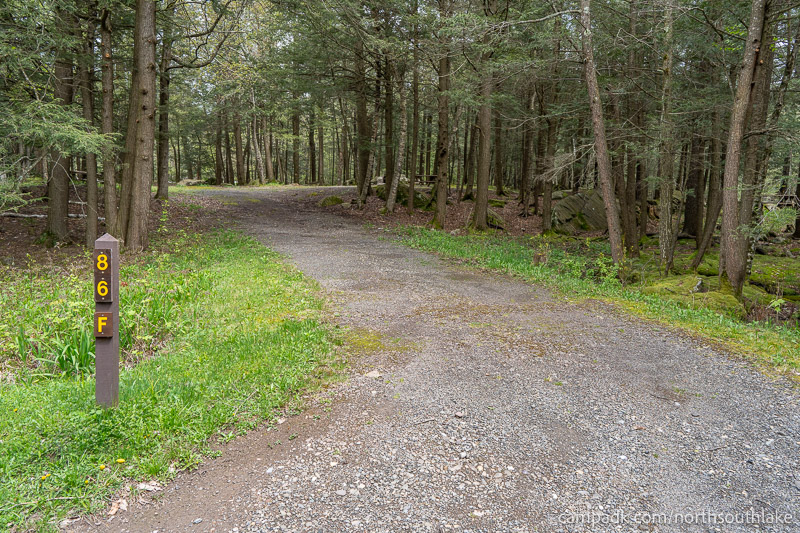 Campsite Photo of Site 86F at North South Lake Campground, New York - Looking at Site from Road Sign Visible