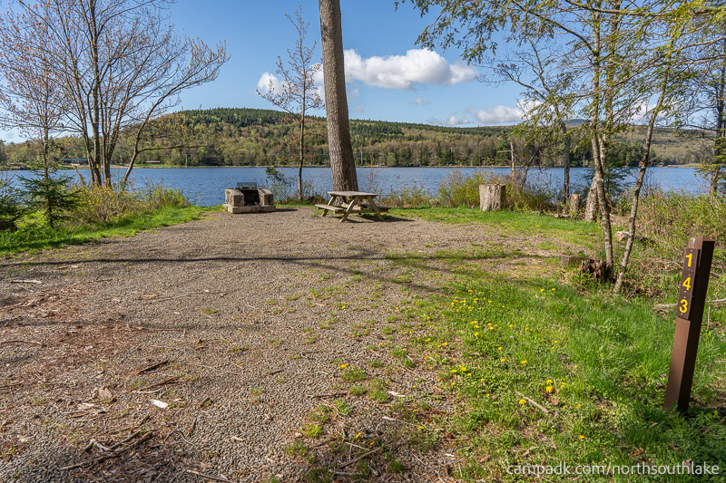 Campsite Photo of Site 143 at North South Lake Campground, New York - Looking at Site from Road Sign Visible
