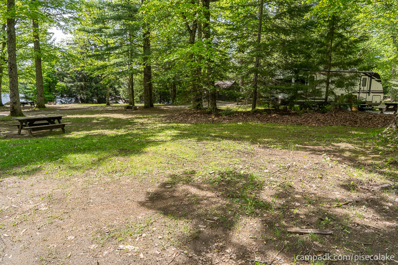 Campsite Photo of Site 78 at Piseco Lake Campground, New York - Looking at Site from Road Sign Visible