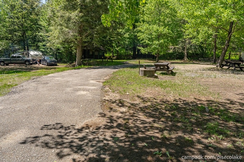 Campsite Photo of Site 67 at Piseco Lake Campground, New York - Looking at Site from Road Sign Visible