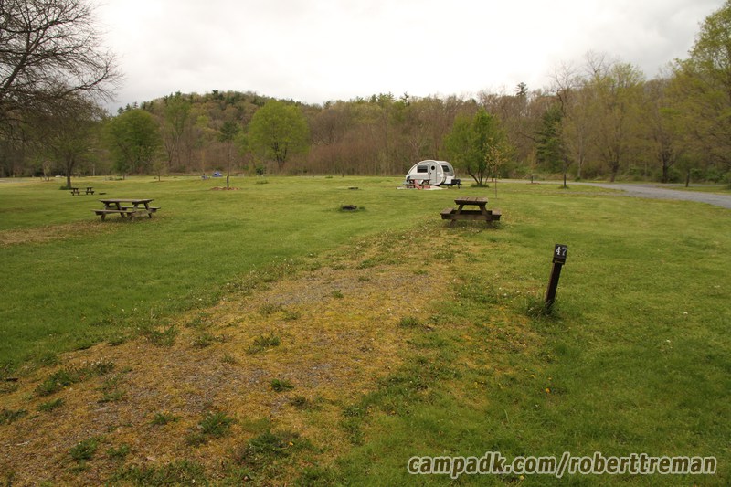 Campsite Photo of Site 47 at Robert H Treman State Park, New York - Looking at Site from Road Sign Visible