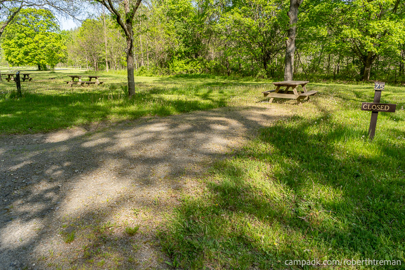 Campsite Photo of Site 75 at Robert H Treman State Park, New York - Looking at Site from Road Sign Visible