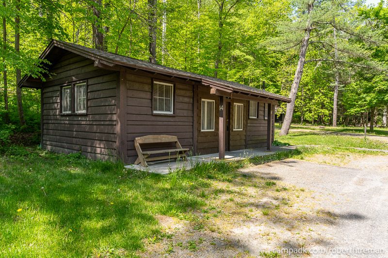 Campsite Photo of Site 14 at Robert H Treman State Park, New York - Looking at Site from Road Sign Visible