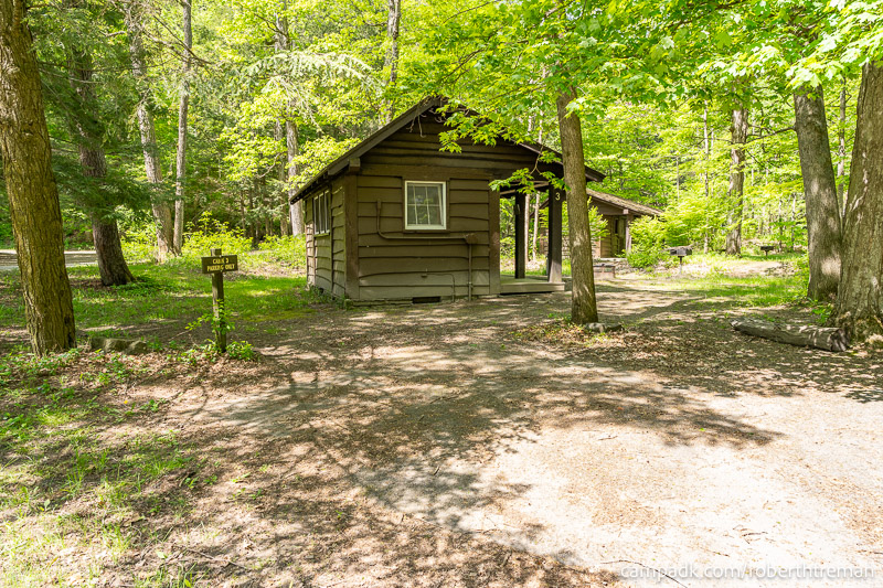 Campsite Photo of Site 3 at Robert H Treman State Park, New York - Looking at Site from Road Sign Visible