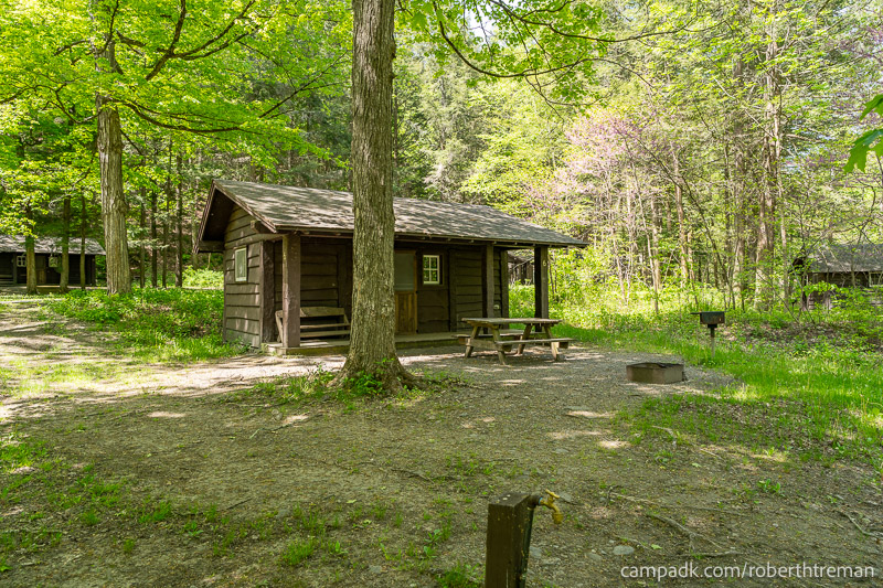 Campsite Photo of Site 6 at Robert H Treman State Park, New York - Looking at Site from Road Sign Visible