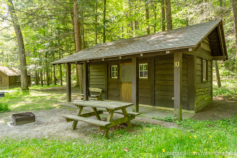 Campsite Photo of Site 10 at Robert H Treman State Park, New York - Looking at Site from Road Sign Visible