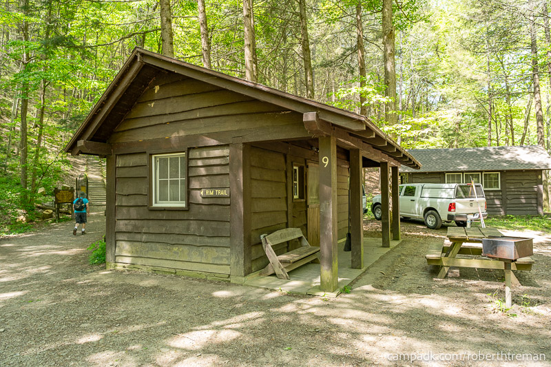 Campsite Photo of Site 9 at Robert H Treman State Park, New York - Looking at Site from Road Sign Visible