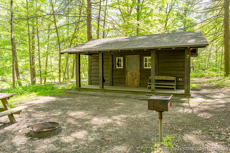 Campsite Photo of Site 7 at Robert H Treman State Park, New York - Looking at Site from Road Sign Visible