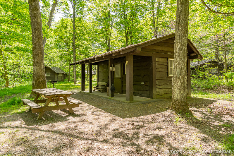 Campsite Photo of Site 13 at Robert H Treman State Park, New York - Looking at Site from Road Sign Visible
