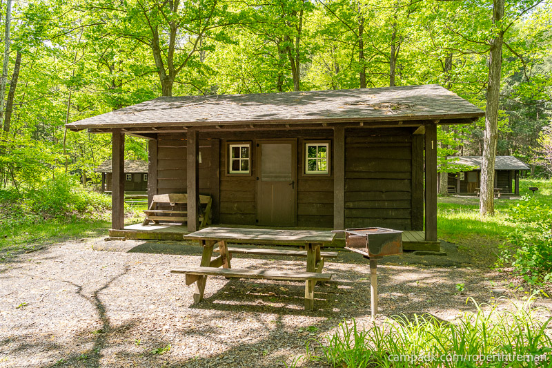 Campsite Photo of Site 1 at Robert H Treman State Park, New York - Looking at Site from Road Sign Visible