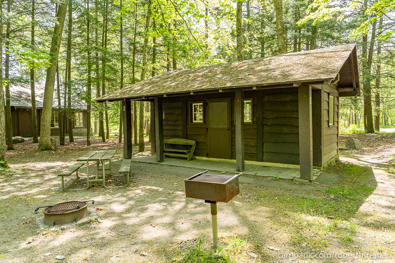 Campsite Photo of Site 2 at Robert H Treman State Park, New York - Looking at Site from Road Sign Visible