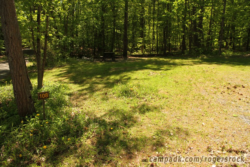 Campsite Photo of Site 108 at Rogers Rock Campground, New York - Looking at Site from Road Sign Visible