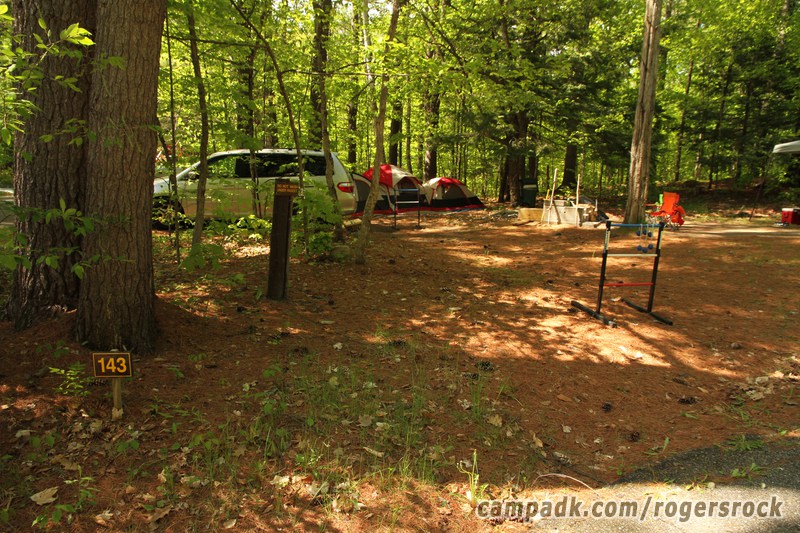 Campsite Photo of Site 143 at Rogers Rock Campground, New York - Looking at Site from Road Sign Visible