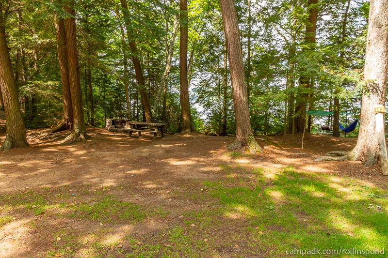 Campsite Photo of Site 143 at Rollins Pond Campground, New York - Looking at Site from Road Sign Visible