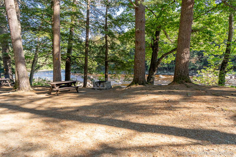 Campsite Photo of Site 5 at Sacandaga Campground, New York - Looking at Site from Road Sign Visible