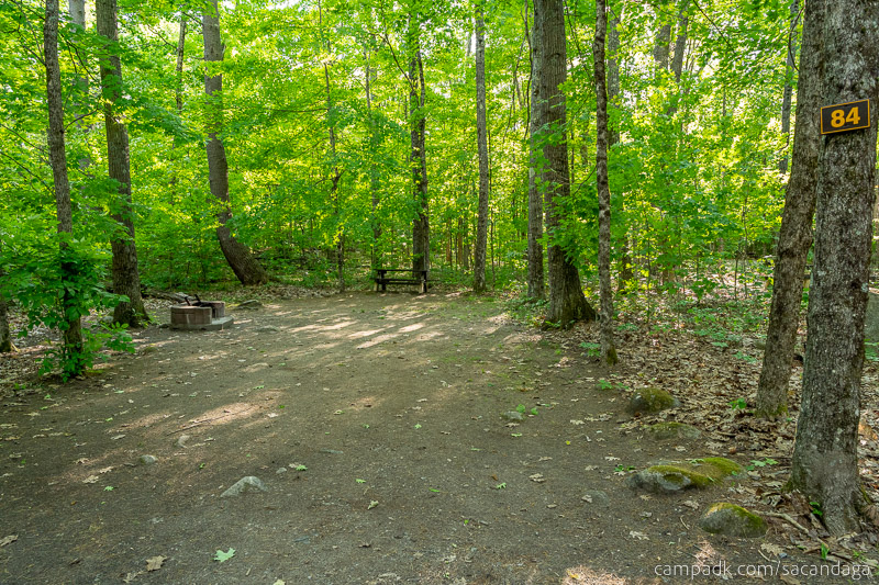 Campsite Photo of Site 84 at Sacandaga Campground, New York - Looking at Site from Road Sign Visible