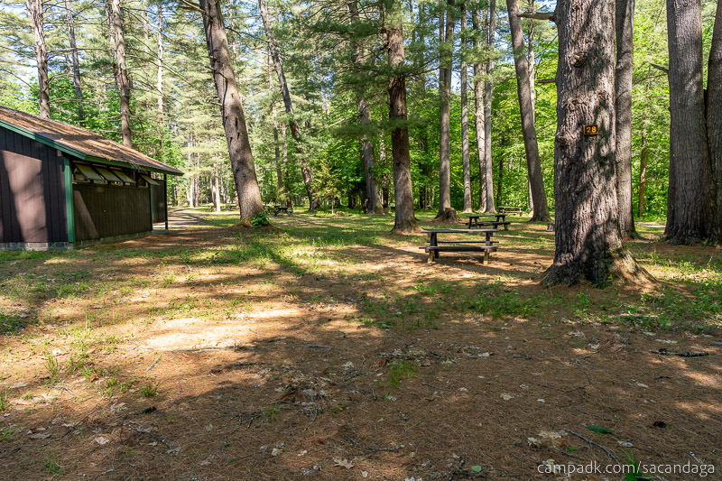 Campsite Photo of Site 28 at Sacandaga Campground, New York - Looking at Site from Road Sign Visible