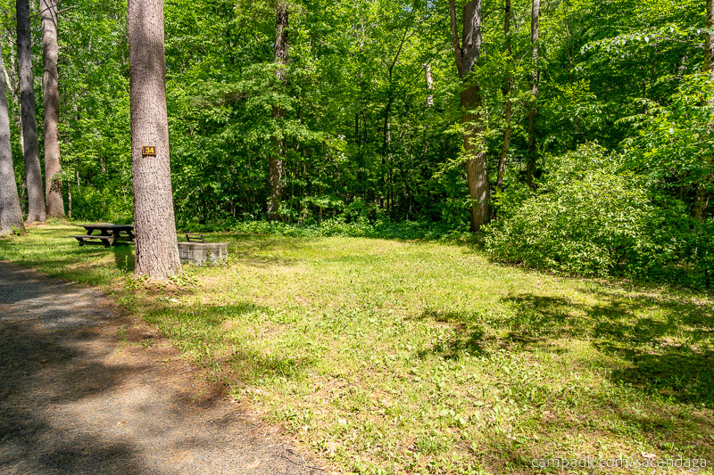 Campsite Photo of Site 34 at Sacandaga Campground, New York - Looking at Site from Road Sign Visible
