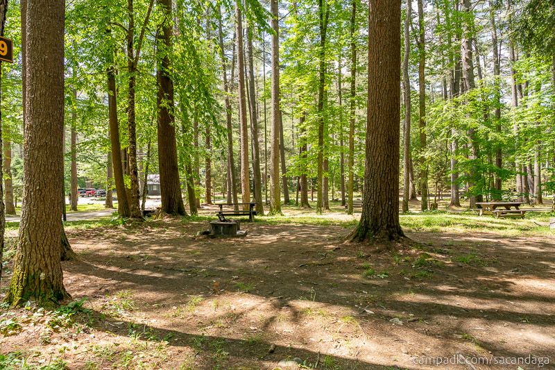 Campsite Photo of Site 59 at Sacandaga Campground, New York - Looking at Site from Road Sign Visible