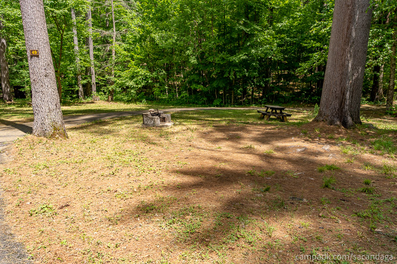 Campsite Photo of Site 49 at Sacandaga Campground, New York - Looking at Site from Road Sign Visible