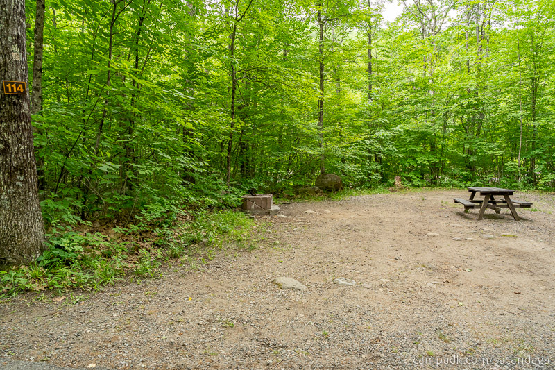 Campsite Photo of Site 114 at Sacandaga Campground, New York - Looking at Site from Road Sign Visible