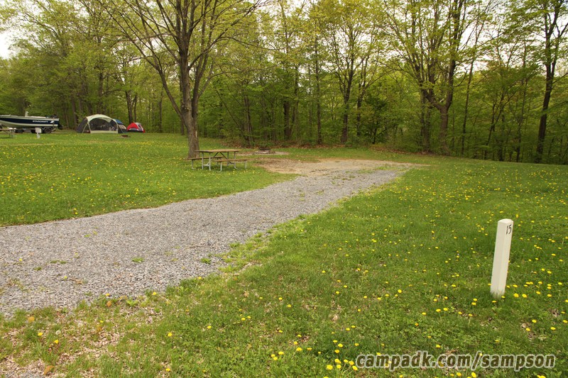 Campsite Photo of Site 15 at Sampson State Park, New York - Looking at Site from Road Sign Visible