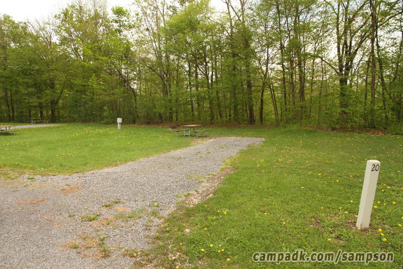 Campsite Photo of Site 20 at Sampson State Park, New York - Looking at Site from Road Sign Visible