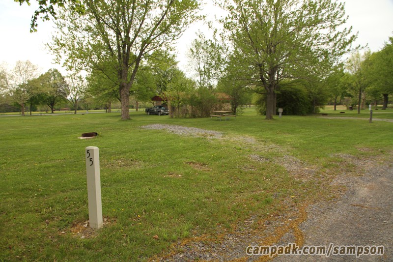 Campsite Photo of Site 55 at Sampson State Park, New York - Looking at Site from Road Sign Visible