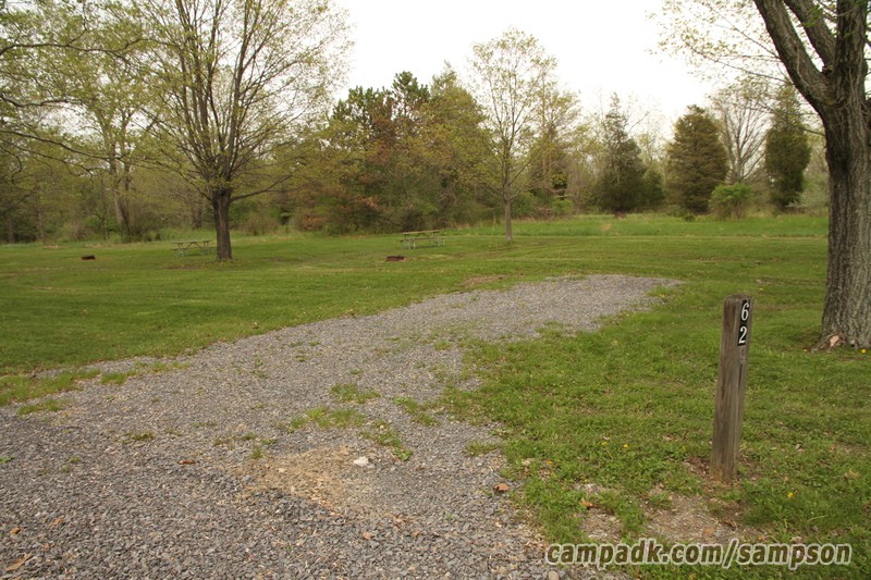 Campsite Photo of Site 62 at Sampson State Park, New York - Looking at Site from Road Sign Visible
