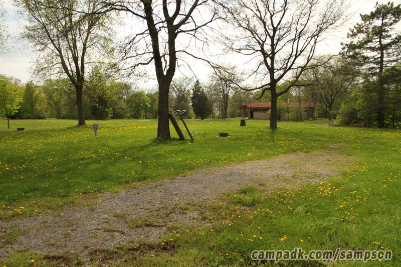 Campsite Photo of Site 137 at Sampson State Park, New York - Looking at Site from Road Sign Visible