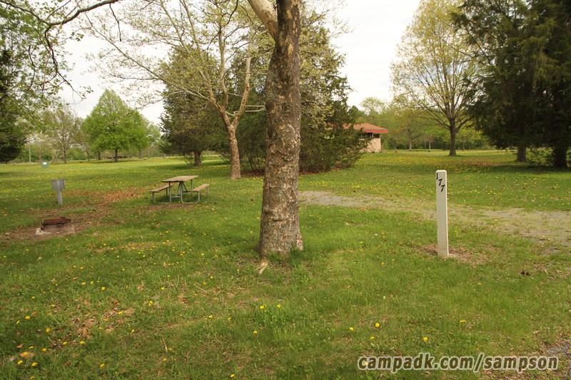 Campsite Photo of Site 177 at Sampson State Park, New York - Looking at Site from Road Sign Visible