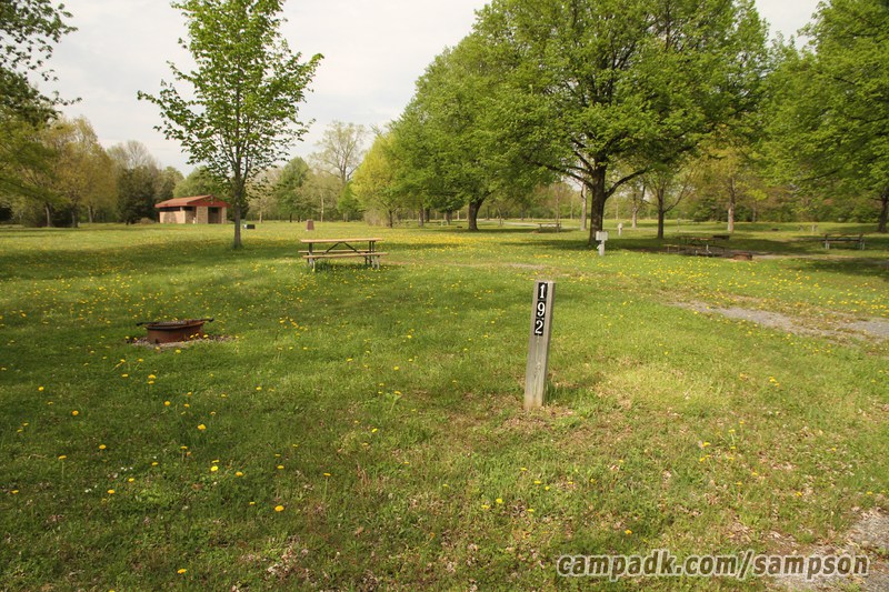 Campsite Photo of Site 192 at Sampson State Park, New York - Looking at Site from Road Sign Visible