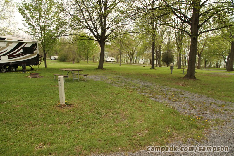 Campsite Photo of Site 217 at Sampson State Park, New York - Looking at Site from Road Sign Visible