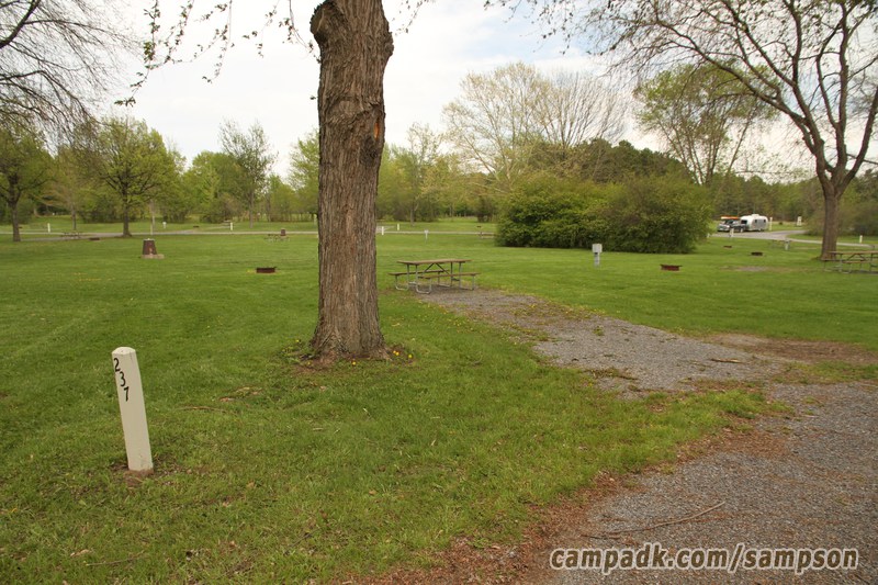 Campsite Photo of Site 237 at Sampson State Park, New York - Looking at Site from Road Sign Visible
