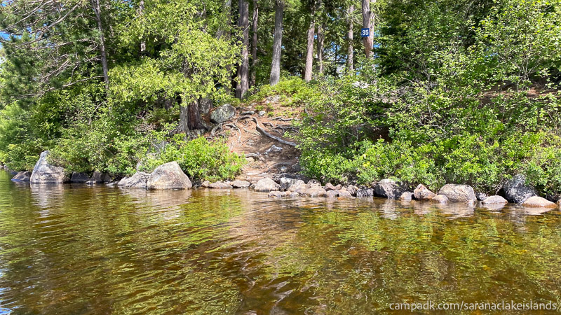 Campsite Photo of Site 35 at Saranac Lake Islands Campground, New York - View From Water on Approach