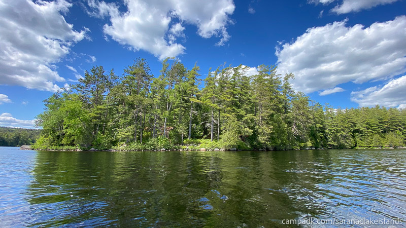 Campsite Photo of Site 12 at Saranac Lake Islands Campground, New York - View From Water on Approach