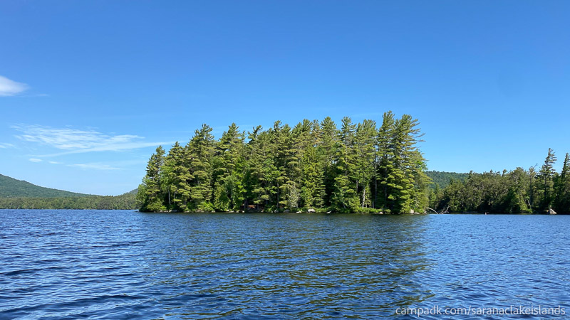 Campsite Photo of Site 24 at Saranac Lake Islands Campground, New York - View From Water on Approach