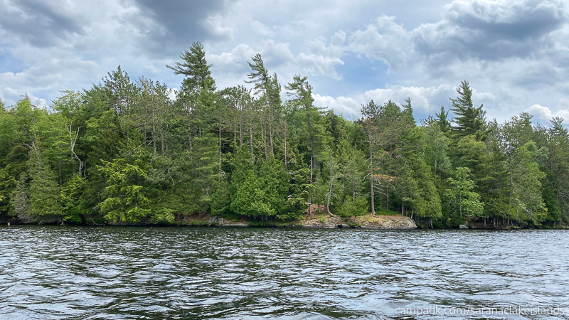 Campsite Photo of Site 57 at Saranac Lake Islands Campground, New York - View From Water on Approach
