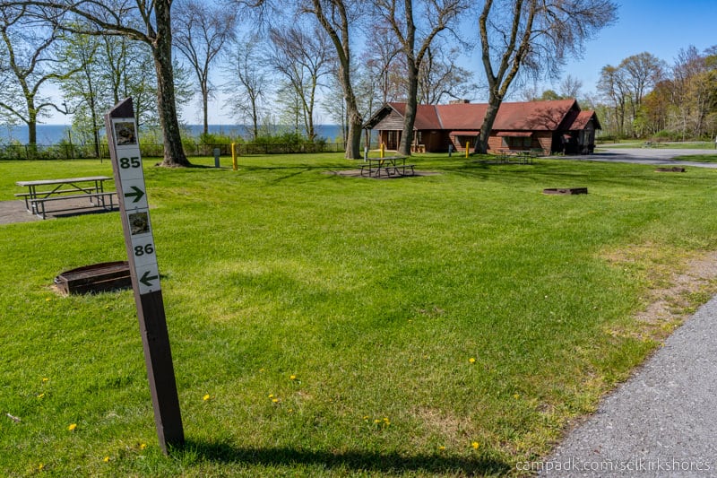 Campsite Photo of Site 85 at Selkirk Shores State Park, New York - Looking at Site from Road Sign Visible