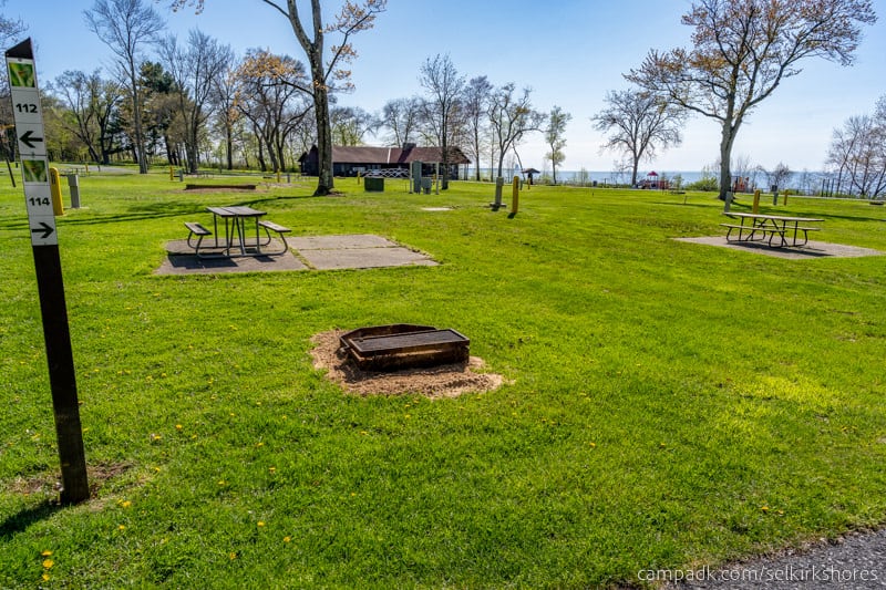 Campsite Photo of Site 114 at Selkirk Shores State Park, New York - Looking at Site from Road Sign Visible