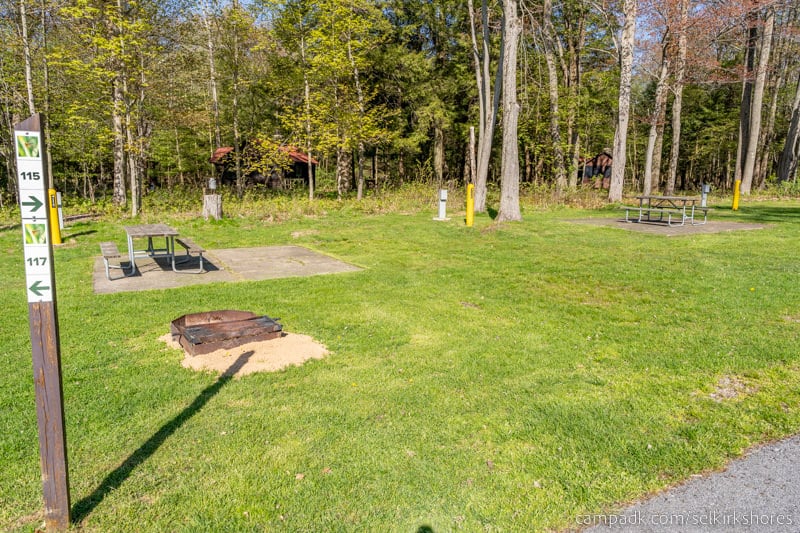 Campsite Photo of Site 115 at Selkirk Shores State Park, New York - Looking at Site from Road Sign Visible