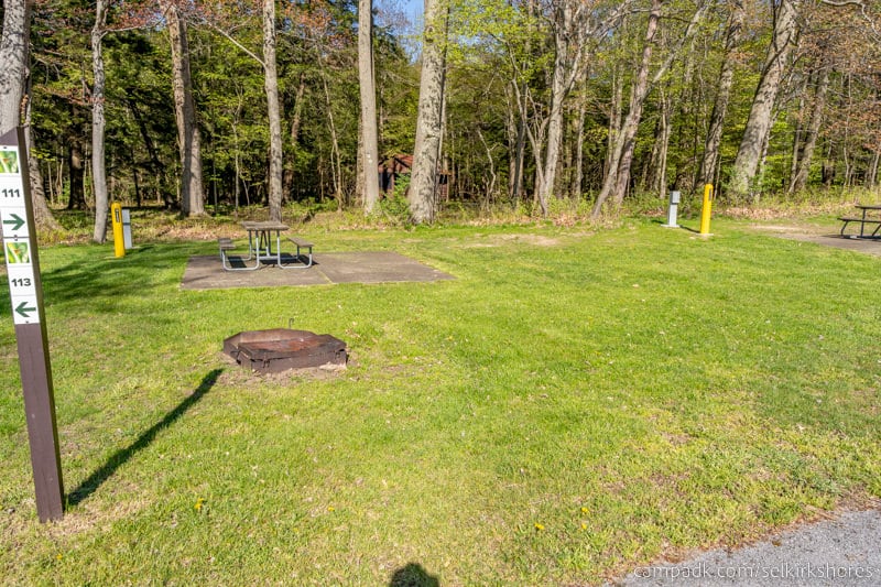 Campsite Photo of Site 111 at Selkirk Shores State Park, New York - Looking at Site from Road Sign Visible
