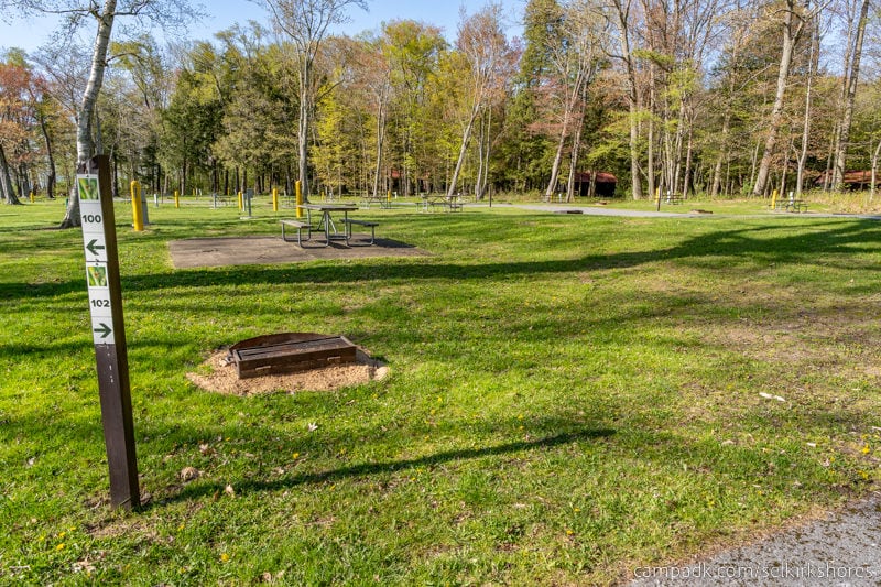 Campsite Photo of Site 102 at Selkirk Shores State Park, New York - Looking at Site from Road Sign Visible