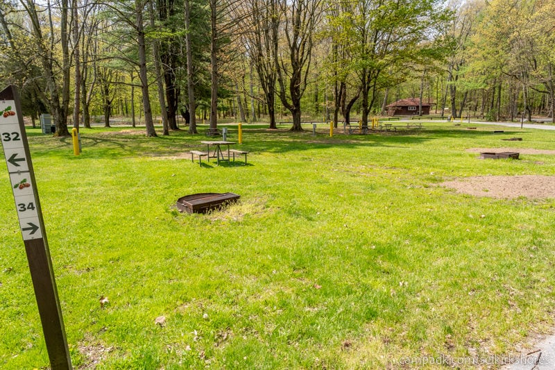 Campsite Photo of Site 34 at Selkirk Shores State Park, New York - Looking at Site from Road Sign Visible