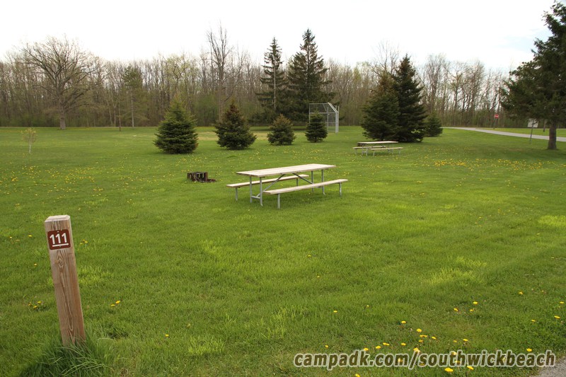 Campsite Photo of Site 111 at Southwick Beach State Park, New York - Looking at Site from Road Sign Visible