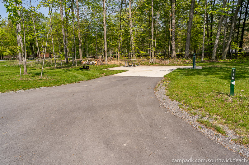 Campsite Photo of Site 116 at Southwick Beach State Park, New York - Looking at Site from Road Sign Visible
