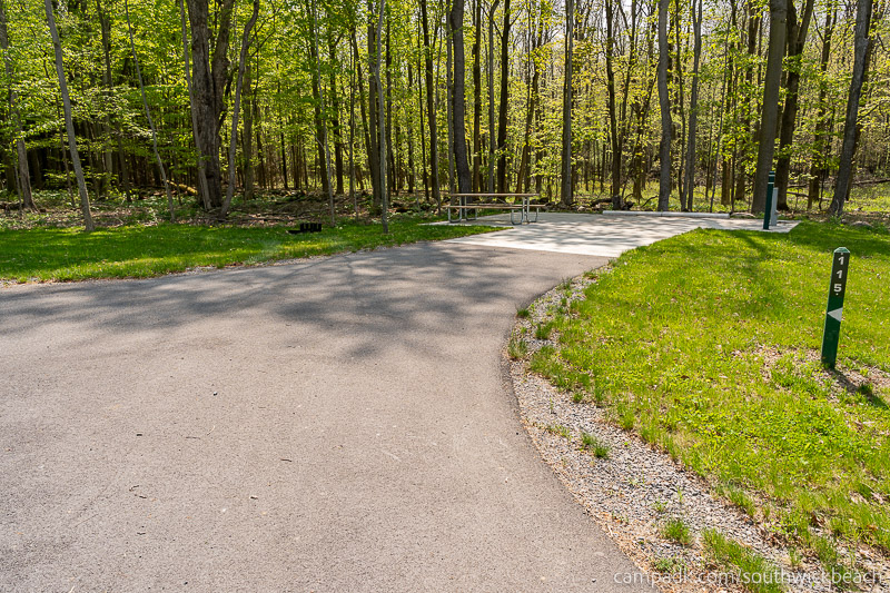 Campsite Photo of Site 115 at Southwick Beach State Park, New York - Looking at Site from Road Sign Visible