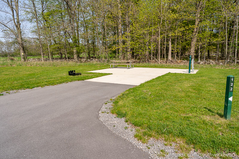 Campsite Photo of Site 122 at Southwick Beach State Park, New York - Looking at Site from Road Sign Visible