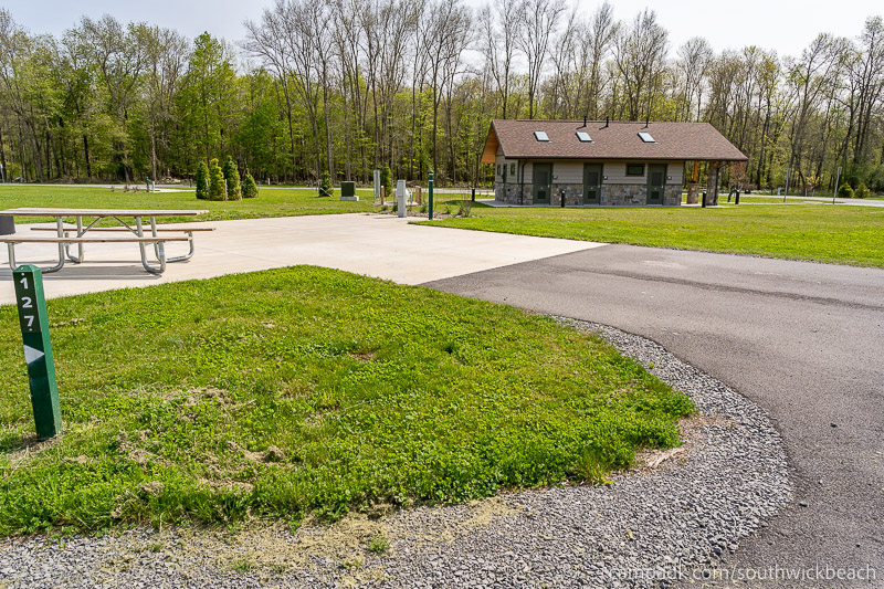 Campsite Photo of Site 127 at Southwick Beach State Park, New York - Looking at Site from Road Sign Visible