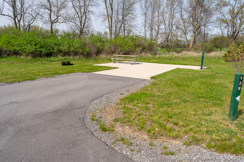 Campsite Photo of Site 128 at Southwick Beach State Park, New York - Looking at Site from Road Sign Visible